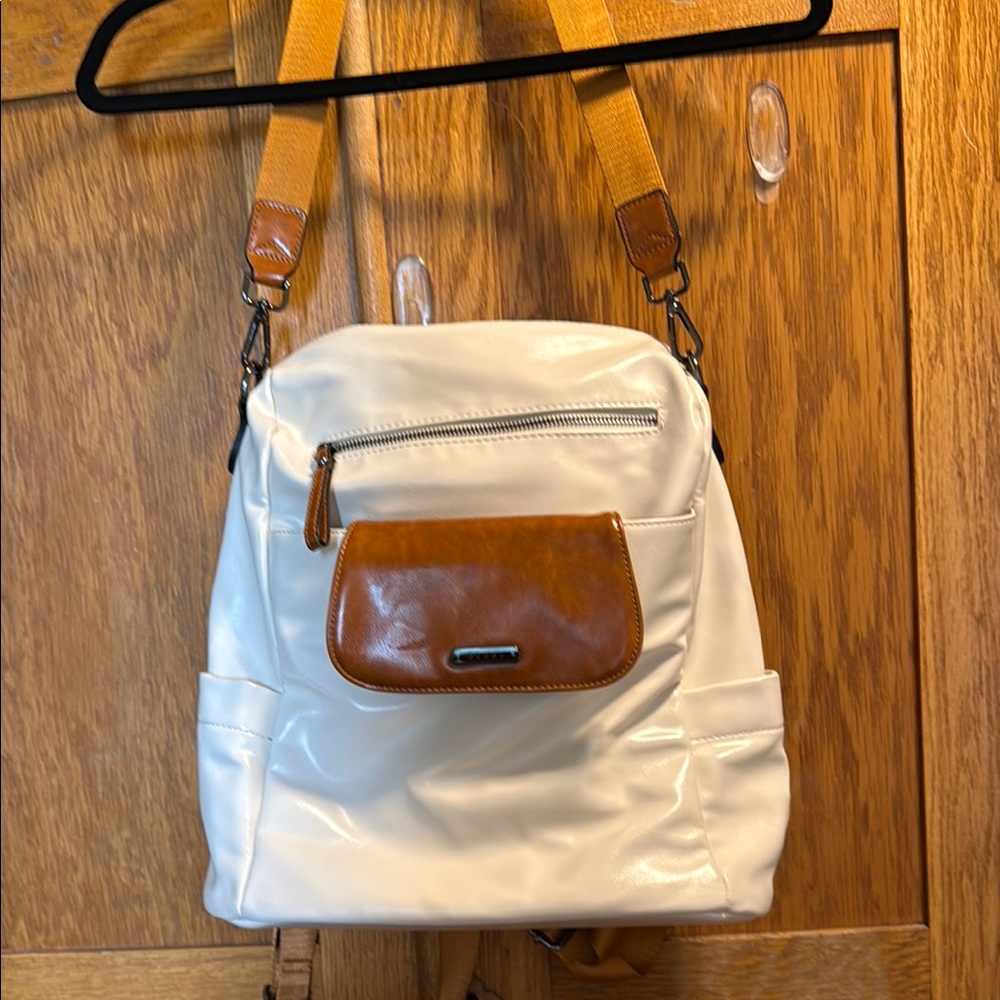 Cluci vinyls backpack or over the shoulder great condition.  Nylon lining.